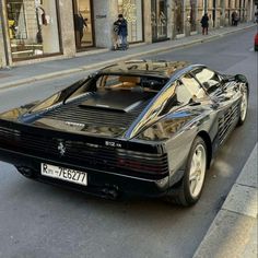 a black sports car parked on the street