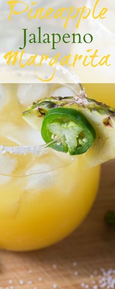 a pineapple jalapeno margarita is garnished with a slice of green pepper