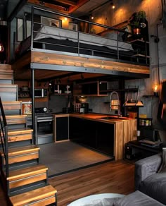 a loft bed with stairs leading up to it