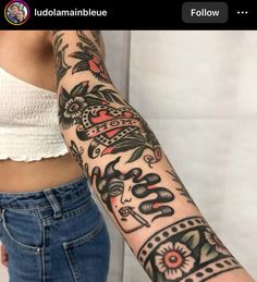 a woman's arm with tattoos on it