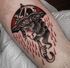 a woman with an umbrella tattoo on her arm is shown in black and red ink