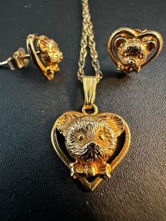 Best gift: A Touch of Nostalgic Charm; Vintage Hallmarked 9K Gold Teddy Bear Necklace and Earrings Set Relive childhood memories with this adorable vintage teddy bear jewelry set. Crafted from hallmarked 9 carat yellow gold, this set features a charming teddy bear pendant and matching earrings. The timeless design is perfect for adding a touch of whimsy to any outfit. Key Features: Vintage: A nostalgic piece of jewelry history. 9K Yellow Gold: The high-quality gold ensures durability and a lustr Teddy Bear Design, Bear Pendant, Bear Necklace, Vintage Teddy Bears, Sheffield, Necklace Earring Set, Vintage Jewellery, Hallmark, Matching Earrings