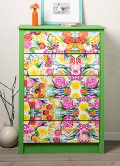 a colorful dresser with flowers painted on it