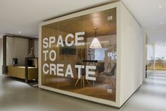 an office with glass walls that says space to create