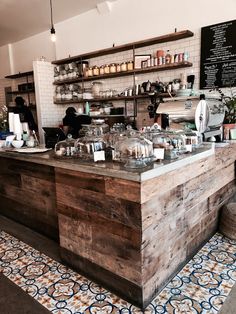 the inside of a coffee shop with lots of counter space