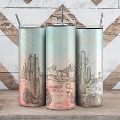 three travel mugs with cactus designs on them