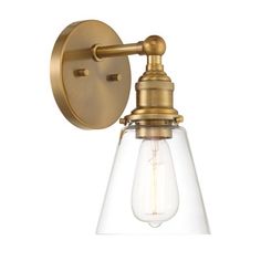 an antique brass finish wall light with clear glass shades and a bulb on the side