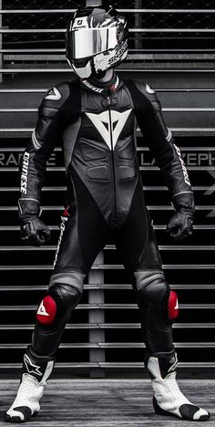 a person in a black and white motorcycle suit