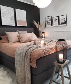 a bedroom with a bed, stools and pictures on the wall