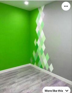 an empty room with green and white walls