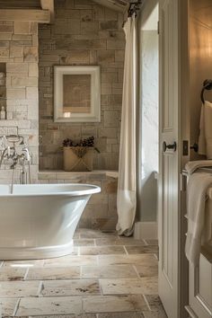 a white bath tub sitting inside of a bathroom