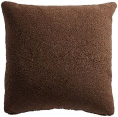 a brown pillow on a white background