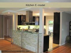 an open kitchen and living room with hardwood floors in the middle is featured on this page