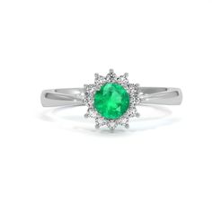 Intense Round Emerald circled with VS1 White Diamonds in an 18k White Gold setting. The Emerald is 4.50 x 4.50 x 3.05mm and has minor clarity enhancement. The Diamonds have no enhancement.  #emerald  #engagementringssimple #gorgeousrings #ringstyles #weddingringsemerald #emeraldweddingring Luxury Green Diamond Ring With Brilliant Cut, Dazzling Green Diamond Ring For Formal Occasions, Elegant Green Diamond Ring With Center Stone, Green Diamond Ring For Formal Occasions, Classic Emerald Ring With Diamond White Color, Classic Solitaire Diamond Ring For May Birthstone, Luxury Round Diamond Emerald Ring With Halo Setting, Classic Diamond Ring With May Birthstone, Classic Round Emerald Diamond Ring