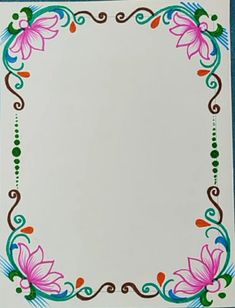 a white card with pink flowers and swirls on it's edges is shown