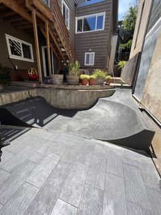 a skateboard ramp in front of a house