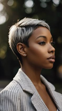 : Make a bold statement with short pixie hairstyles perfect for black women. Check out our website for bold styling tips. Save this pin for bold haircut inspiration. #BoldStyle #PixieHairstyles #BlackWomen Bob Short Hairstyles For Black Women, Grey Pixie Haircut Black Women, Grey Dyed Hair Black Women, Soft Pixie Haircut Fine Hair, Short Hair Women Over 50, Bold Haircut, Lady Guinevere, Hair Shapes, Pixie Haircut For Black Women