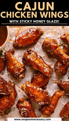 chicken wings with sticky honey glaze on top and the words cajun chicken wings above it