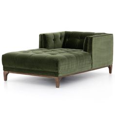 a green velvet chaise lounge chair with wooden legs