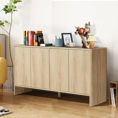 a wooden cabinet with books and pictures on it