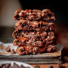 chocolate cookies stacked on top of each other and drizzled with melted chocolate