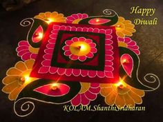 happy diwali with lit candles on the ground in front of an artistic design