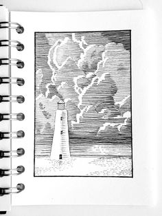 an open spiral notebook with a drawing of a lighthouse and storm clouds in the background