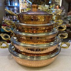 a stack of glass dishes sitting on top of a table