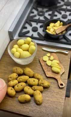 potatoes are being cut up on a cutting board