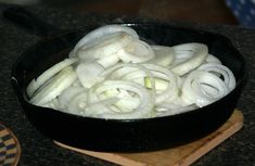 onions are being cooked in a skillet on the stove