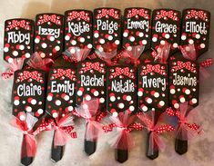 six personalized minnie mouse spatulas with red bows and polka dots on them