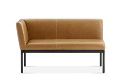 a tan leather couch with black legs on an isolated white background, viewed from the front