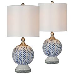 two blue and white lamps with gold accents