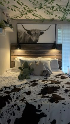 a bed with two stuffed animals on it