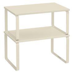 a white side table with two shelves on each side and one shelf below the top