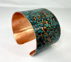 These unique, hand-formed copper and brass cuff bracelets with vibrant patinas create stunning accents to your personal style. Dress up or down- either way you'll be wearing an adornment that will turn heads, start conversations, and delight the eye of the beholder. This is a hammered copper cuff with a bright blue cupric nitrate patina. Please note that patina colors look slightly different depending on the device you view the product on. This is a Large size cuff- see measurements below. Cuffs Artisan Cuff Bracelet With Patina As Gift, Artisan Cuff Bracelet With Patina For Gifts, Bronze Patina Bracelets As A Gift, Bronze Bangle Bracelet With Patina, Artisan Bronze Cuff Bangle Bracelet, Unique Handmade Copper Cuff Bracelet, Bronze Copper Bracelet With Patina, Unique Copper Cuff Bracelet, Adjustable Patina Cuff Bracelet Wearable Art