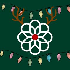 a christmas decoration with lights and reindeer antlers on the green background is featured in this image