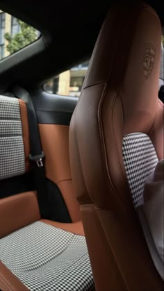 the interior of a car with black and white checkered seats