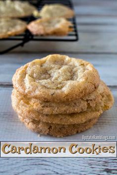 three cookies stacked on top of each other in front of a cooling rack with the words, cardamon cookies