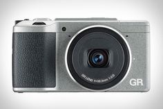 a silver digital camera on a white background