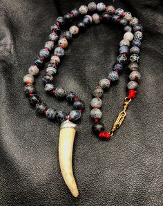 This beautiful necklace was created using ethically sourced deer antler. I capped the antler tip with lead-free, high silver solder.  The necklace hangs 11 inches with the antler adding an additional 1 1/2 inches to the piece.  The crackled agate stand out against the red cording knotted between each bead.  I twisted brass to create the clasp.  This is a beautifully striking, one of a kind necklace. Deer Antler, Deer Antlers, Beautiful Necklace, Antlers, 11 Inches, Minneapolis, Beautiful Necklaces, Favorite Jewelry, Deer