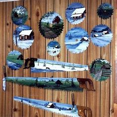 there are many different types of saws hanging on the wooden wall with pictures in them