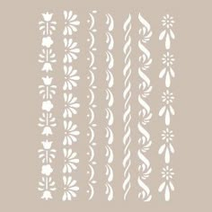 the stencil set is designed to look like flowers and swirls in white on a light gray background