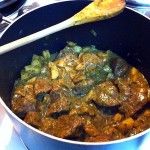 a pan filled with food sitting on top of a stove