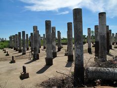 the remains of an ancient roman city are shown in this photo with blue sky and clouds