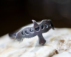 I've created this  beautiful Moon Phase Raven Ring from solid sterling silver.   Plain band, 3.5mm wide. You may choose the finish: Darkly Antiqued, Lightly Antiqued/brushed, or Shiny polished sterling.  Any size.   Gift boxed with bow. Note: Other patterned bands may be substituted upon request.  Unless requested, this ring will come with the plain sterling band. Crow Ring, Raven Ring, Moon Phase Ring, Quoth The Raven, Plain Bands, The Raven, Beautiful Moon, Moon Phases, Hogwarts