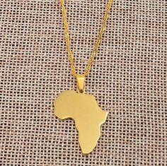 🌍 🌍 🌍 Show your love for The Motherland with this map pendant necklace. Everyday wear for Men and Women. 🌍 🌍 🌍 Each pendant comes with the chain in the picture(s) Do not turn black Do not turn green Do not rust Pendant Metal: Stainless Steel + 18K gold plated Size: In pictures Chain Type: water wave Chain Chain length available: 45 cm / 17.7 inches 50 cm / 19.6 inches 60 cm / 23.6 inches Want a different type of chains? we have 6 different type of chains available in store. Sold separately Men's Necklace Gold, Africa Necklace, African Map, Map Pendant, Map Necklace, Africa Map, Long Chain Necklace, Gold Plated Necklace, Metal Necklaces