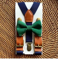 Dark Green Bow Tie & Navy Faux Leather Suspenders- The Perfect Wedding Look! Our navy blue bow tie & suspenders is a great choice for family photos, wedding, ring bearer outfit, birthday celebration or any other special occasion. ❤ **Please Specify Above** SET- Bow Tie and Suspenders SUSPENDERS- One Pair of our Quality Suspenders BOW TIE- One Bow Tie on white elastic strap or alligator clip Small: 9 months- 5 years *Bow Tie: 3.5in wide *Suspenders: Elastic, Y Back, 16in- 27in Medium: 6 y Bow Tie And Suspenders Set For Father's Day Party, Adjustable Green Bow Tie For Father's Day, Adjustable Ribbon Bow Gift, Adjustable Blue Bow With Ribbon, Adjustable Belts And Suspenders For Father's Day Gift, Adjustable Ribbon Bow Tie As Gift, Adjustable Blue Ribbon Bow, Adjustable Belts And Suspenders As Father's Day Gift, Wedding Ring Bearer Outfit