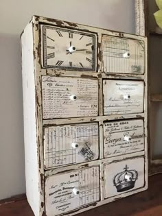 an old dresser with many drawers and clocks on it