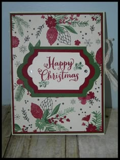 a christmas card with pine cones, holly and pomegranates on it